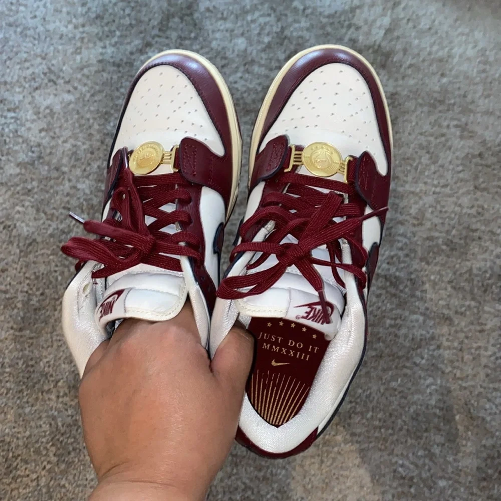 Nike Women's Sneakers in White and Burgundy with Gold Accents